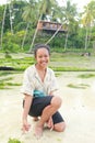 Smiling Papuan woman on sandy beach and shallow sea Royalty Free Stock Photo