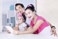 Smiling parents and child using digital tablet Royalty Free Stock Photo
