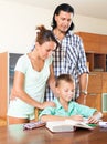 Smiling parents helping with homework Royalty Free Stock Photo