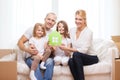 Smiling parents and two little girls at new home Royalty Free Stock Photo