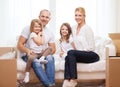 Smiling parents and two little girls at new home Royalty Free Stock Photo