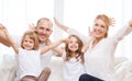 Smiling parents and two little girls at new home Royalty Free Stock Photo