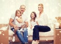 Smiling parents and two little girls at new home Royalty Free Stock Photo