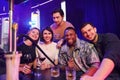 Smiling and partying. Group of friends having fun in the night club together Royalty Free Stock Photo