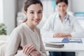 Smiling patient in the GP`s office