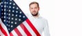 Smiling patriotic man holding United States flag. USA celebrate 4th July. Royalty Free Stock Photo