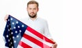 Smiling patriotic man holding United States flag. USA celebrate 4th July. Royalty Free Stock Photo