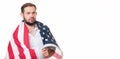 Smiling patriotic man holding United States flag. USA celebrate 4th July. Royalty Free Stock Photo