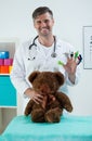 Smiling pediatrician in his office