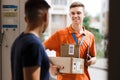 A smiling person wearing an orange T-shirt and a name tag is delivering parcels to a client. Friendly worker, high
