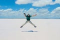 Smiling photographer jumps into the Tuz Golu salt lake