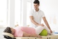Physiotherapist supporting senior woman