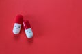 Smiling Pills Capsule like Cartoon Character isolated on red background with copy spase