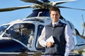 Portrait Of Pilot Standing In Front Of Helicopter With Digital T Royalty Free Stock Photo
