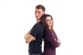 Smiling pin-up girl is standing next to a high cute guy back to back Royalty Free Stock Photo