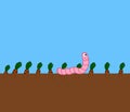 A smiling pink worm crawling on the ground in a vegetable field - illustration