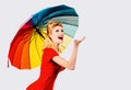 Smiling pinup woman with rain umbrella. Rainy rainbow autumn mood, girl isolated white.