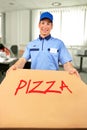 Smiling pizza delivery man holding pizza box Royalty Free Stock Photo