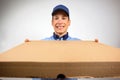 Smiling pizza delivery man holding pizza box