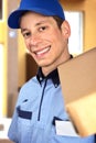 Smiling pizza delivery man holding pizza box