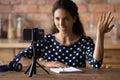 Smiling pleasant woman influencer recording video on smartphone. Royalty Free Stock Photo