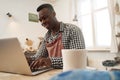 Joyous potter working on laptop in studio Royalty Free Stock Photo