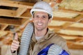 Smiling plumber giving thumbs-up