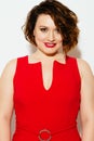 Smiling plump model in red dress Royalty Free Stock Photo