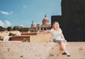 Smiling plus size model girl on stairs Royalty Free Stock Photo