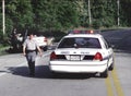 Smiling police offiecr at the scene of a traffic accident in Beltsville, Maryland