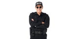 Smiling policeman wearing uniform with arms folded Royalty Free Stock Photo