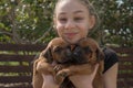 Young girl with Ridgeback puppies