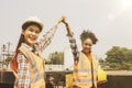 Female engineers work as a multi-ethnic team of happy working sites at the train station. Royalty Free Stock Photo