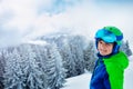 Boy in ski helmet and mask smile standing over forest Royalty Free Stock Photo