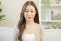 Smiling positive, attractive asian young woman wearing casual dress, portrait of beautiful brunette her with long brown hair, Royalty Free Stock Photo