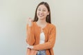 Smiling positive, attractive asian young woman wearing casual dress, portrait of beautiful brunette her with long brown hair, Royalty Free Stock Photo