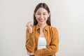 Smiling positive, attractive asian young woman wearing casual dress, portrait of beautiful brunette her with long brown hair, Royalty Free Stock Photo