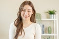 Smiling positive, attractive asian young woman wearing casual dress, portrait of beautiful brunette her with long brown hair, Royalty Free Stock Photo