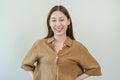 Smiling positive, attractive asian young woman wearing casual dress, portrait of beautiful brunette her with long brown hair, Royalty Free Stock Photo