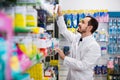 Male pharmacist looking for right medicine Royalty Free Stock Photo