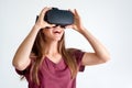 Smiling positive woman wearing virtual reality goggles headset, vr box. Connection, technology, new generation, progress concept.