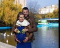 Smiling pregnant couple with baby bootees i Royalty Free Stock Photo