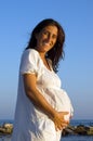 Smiling pregnant woman on the beach Royalty Free Stock Photo