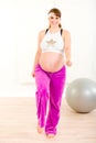 Smiling pregnant woman doing fitness exercises Royalty Free Stock Photo