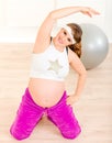 Smiling pregnant woman doing fitness exercises Royalty Free Stock Photo