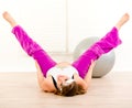 Smiling pregnant woman doing stretching exercises Royalty Free Stock Photo