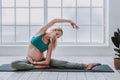 Smiling pregnant woman doing yoga exercises at home Royalty Free Stock Photo