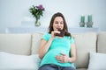 Smiling pregnant woman eating chocolate Royalty Free Stock Photo