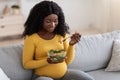Smiling pregnant woman enjoying healthy food, copy space Royalty Free Stock Photo