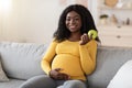 Smiling pregnant woman holding green apple, copy space Royalty Free Stock Photo